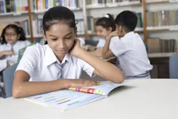 Child studying their book in an Explore centre