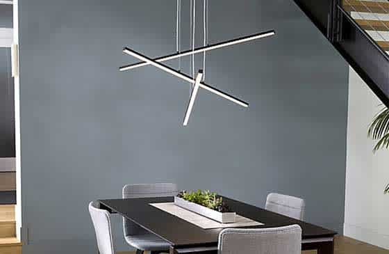 Modern chandelier hanging above a table