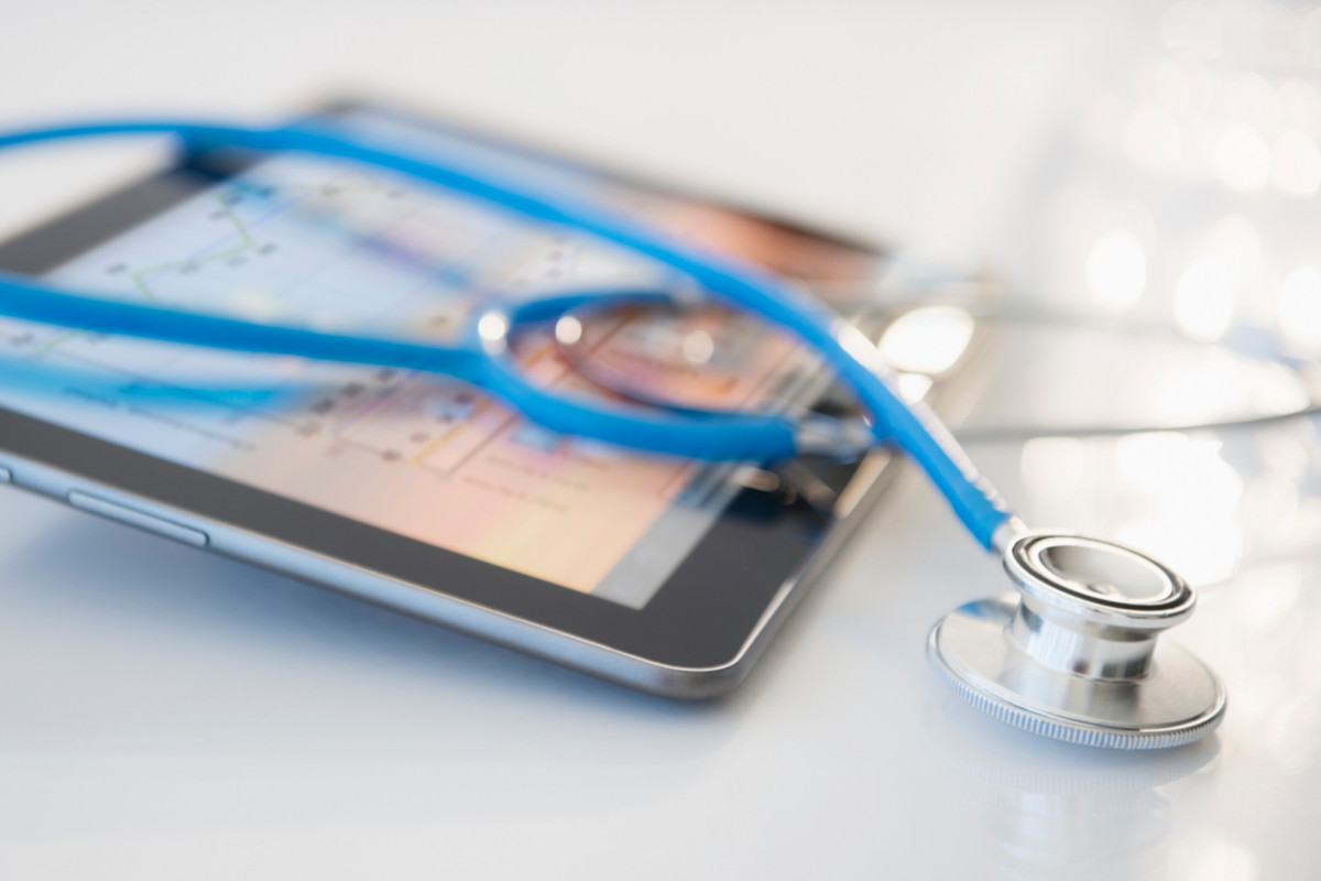 Photo of a stethoscope and a tablet
