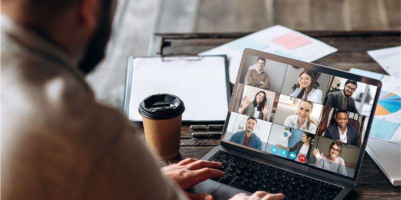 businessman video Microsoft teams conference call in public collaboration space