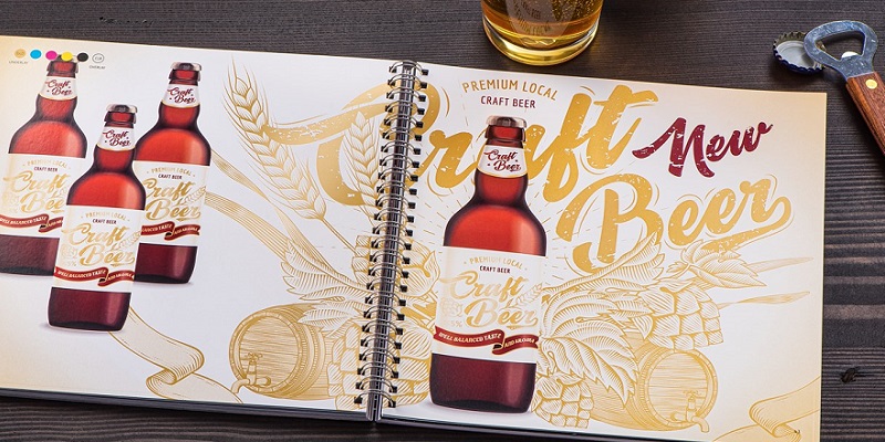 A spiral bound book with color photos of craft beer