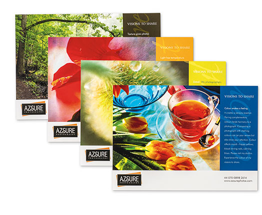 4 colorful postcards displayed in a stack