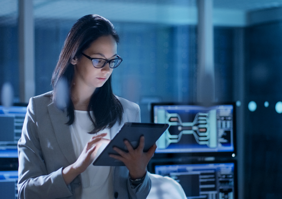 Woman in system control center using a tablet