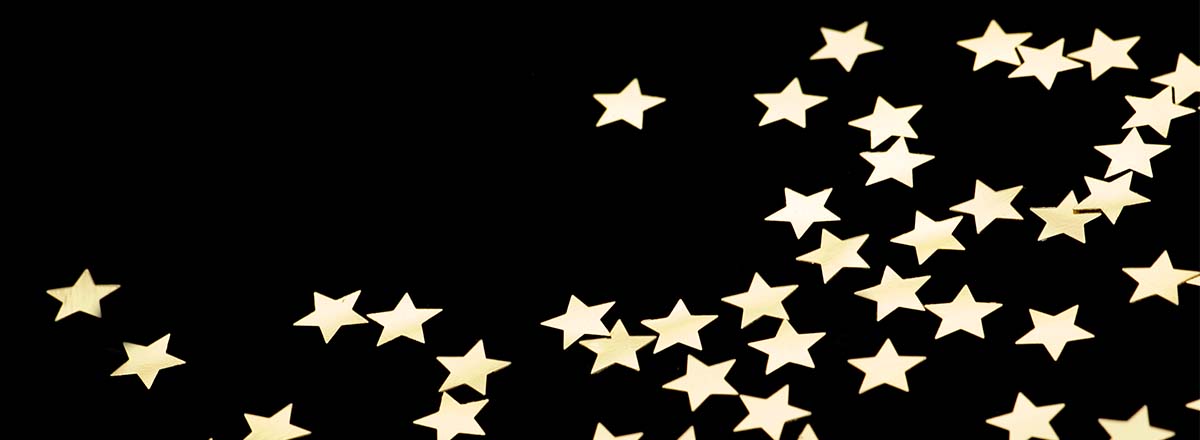 Gold stars on a black background