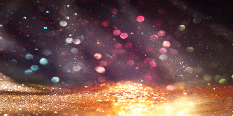 Sunlight through gold sparkles