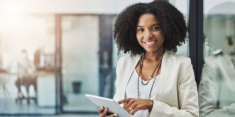 woman holding tablet in office