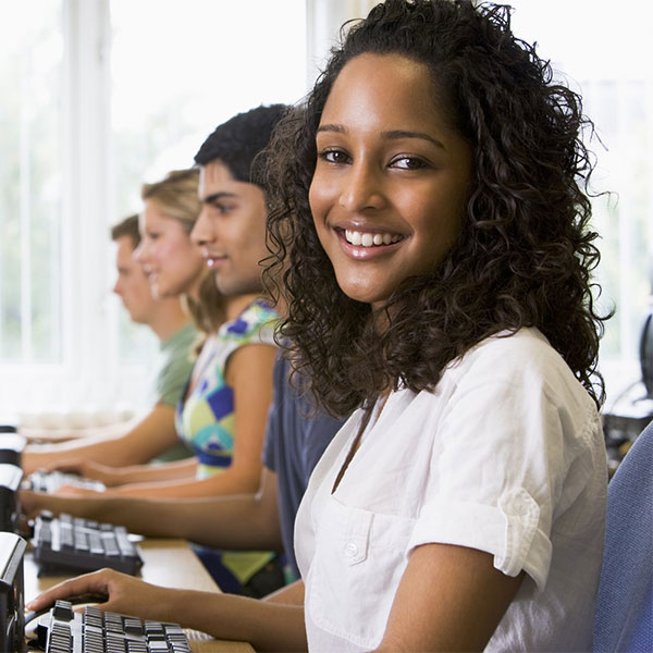 group of young students using computers