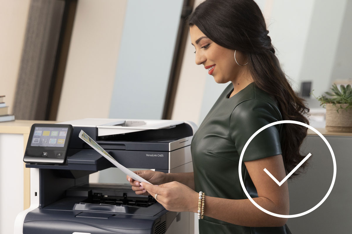 Woman reading print copy from printer