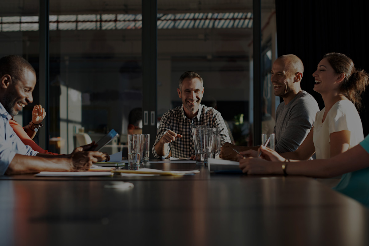 People sitting in a boardroom meeting