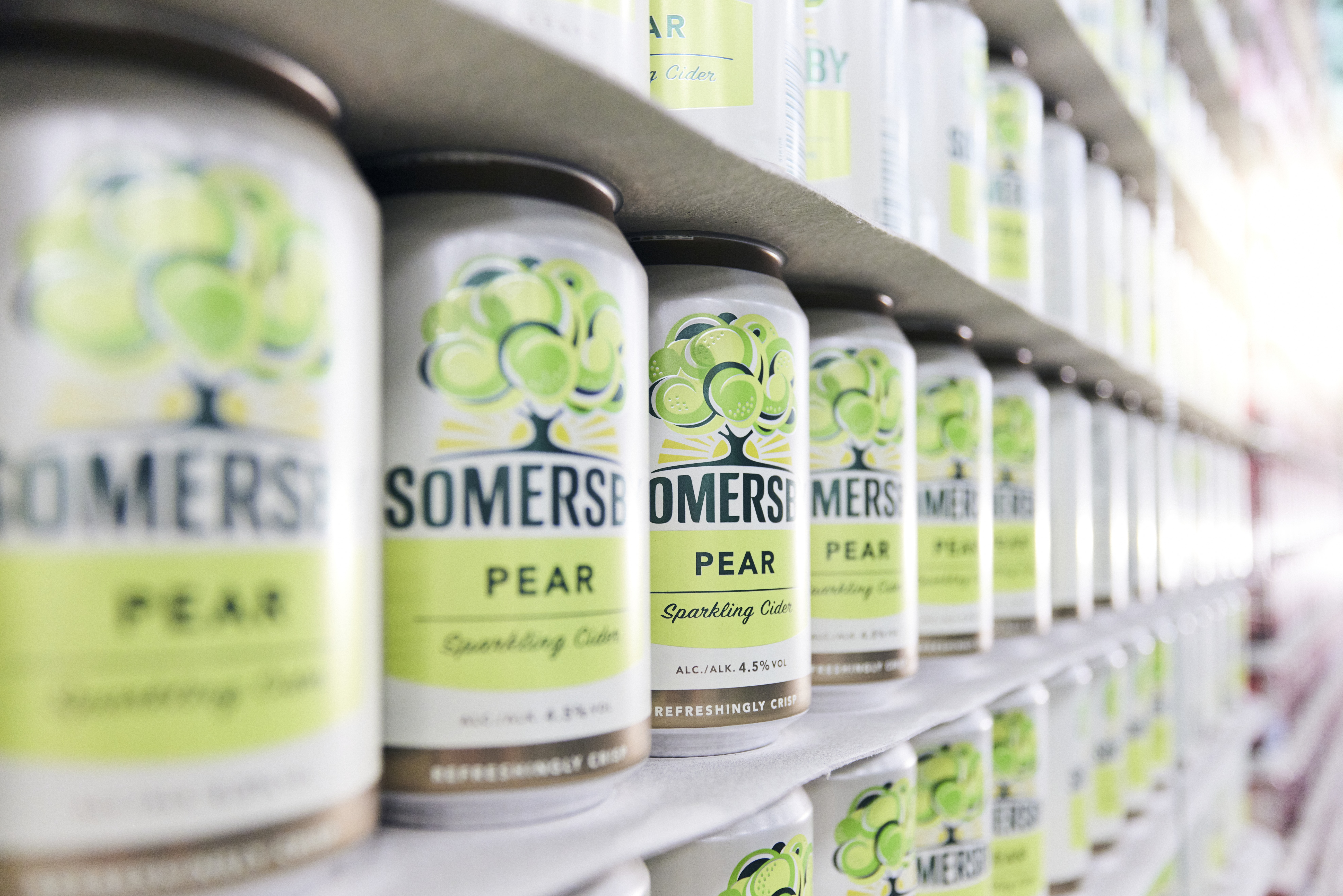 Cans of Somesby on a shelf 