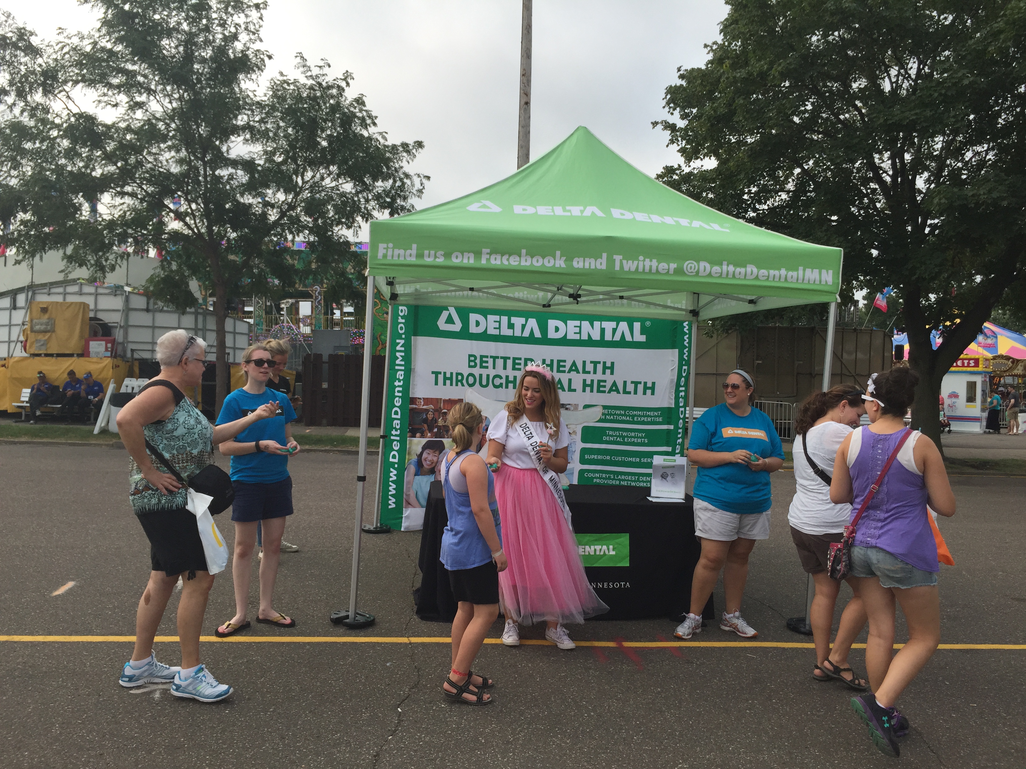 Delta Dental employees talking to fair goes at the great Minnesota get together 2015