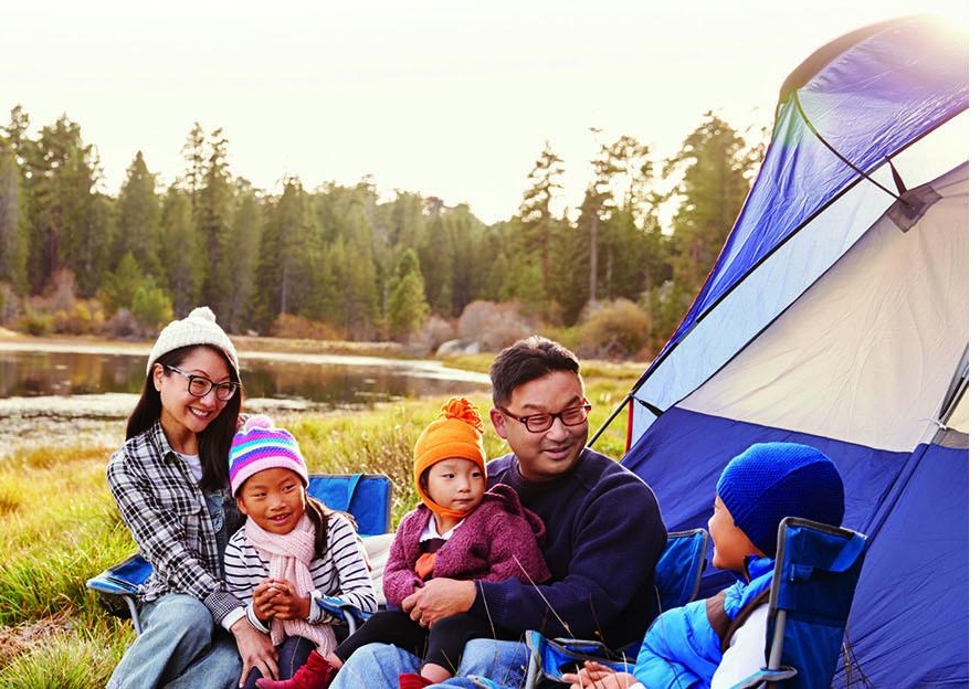 Family camping outdoors