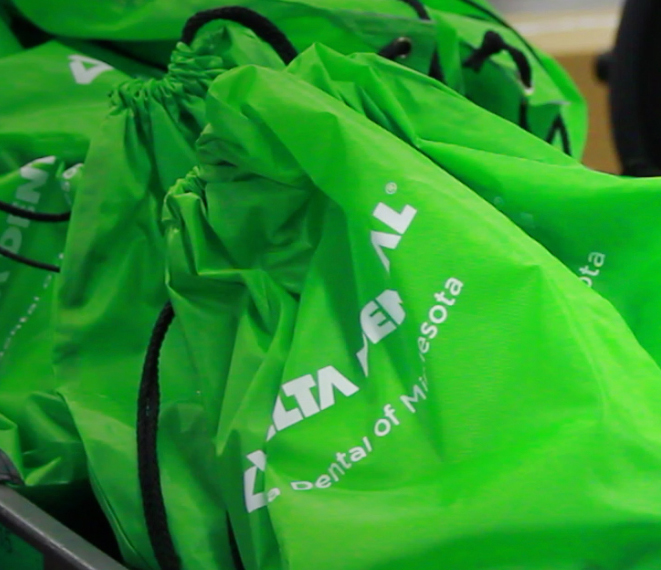 A pile of Delta Dental of Minnesota bags