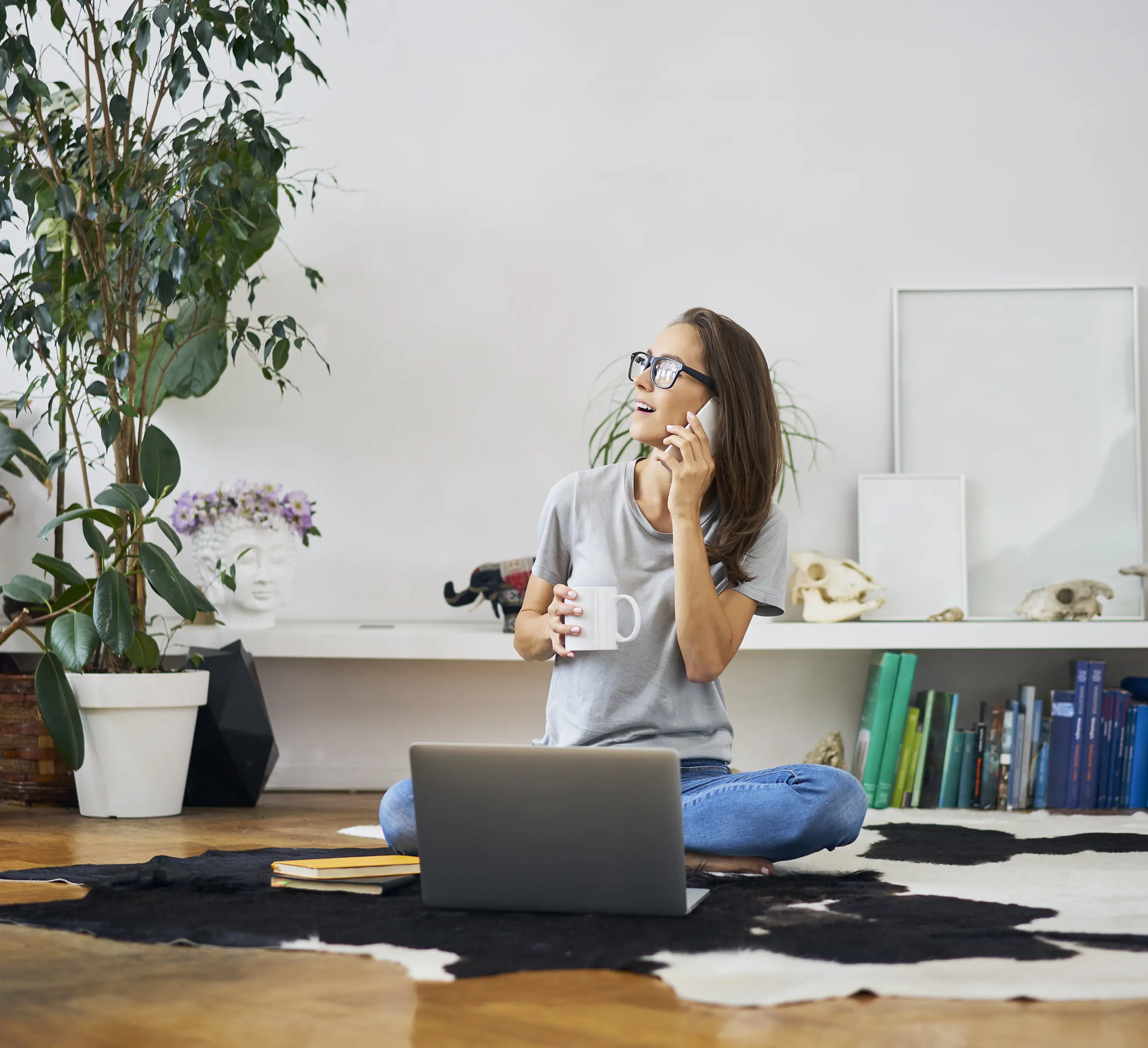 woman drinking tea on the phone