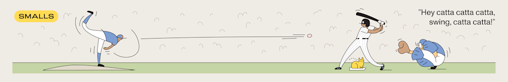 At a Yankee game, a pitcher throws the ball, the batter is ready to swing. All while a cat loafs on home plate.