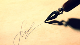 Writing with a fountain pen on a piece of paper Writing on paper