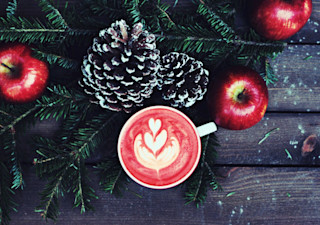 Coffee next to Christmas decoration Christmas vibes