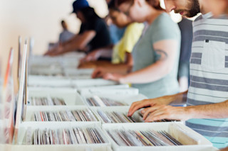 People scrolling through LP's anthony-martino-335460-unsplash