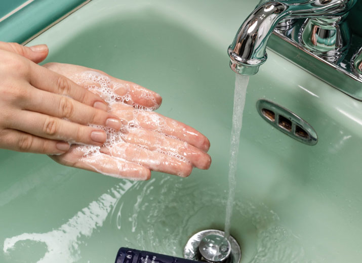 Image shows hands being washed on a sink with water running Health and Beauty industry page - 2020 Consumer report - Image 2