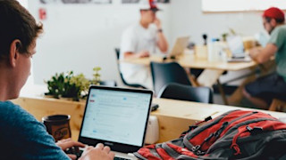 Man behind laptop Getting started with Trustpilot Pro