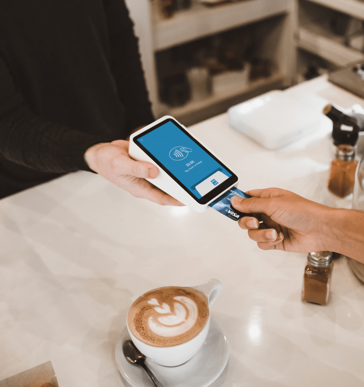 Photo of two persons at a restaurant using a digital device for a money transaction Features - TrustBox Widgets - Revel quote image