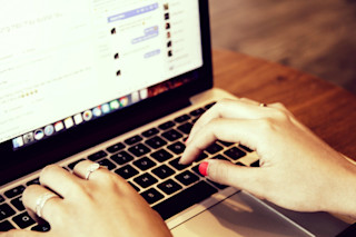 Woman typing on a laptop importance+of+reviews+for+ecommerce