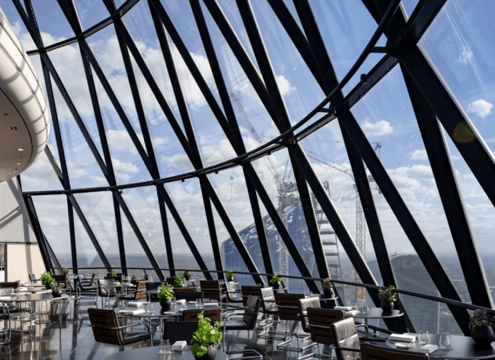 Image of a fancy rooftop restaurant with a sunny view Insurance industry page - Report - Reassured