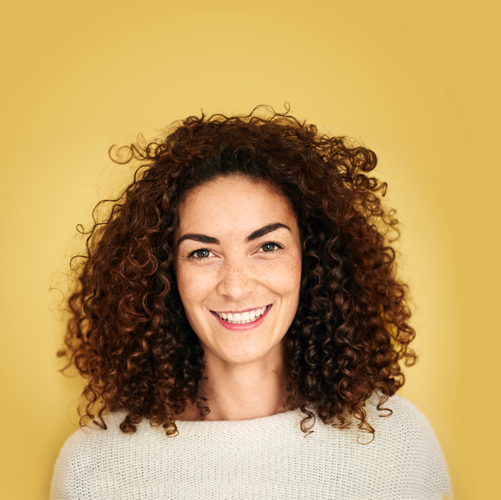 woman-curly-hair-yellow-background 2