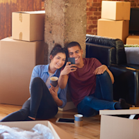 happy couple with packing boxes Thumb