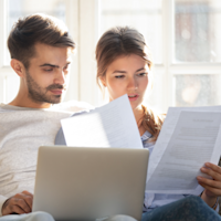 Couple looking at document thumbnail
