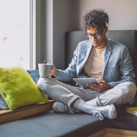 Man reading tablet Thumb