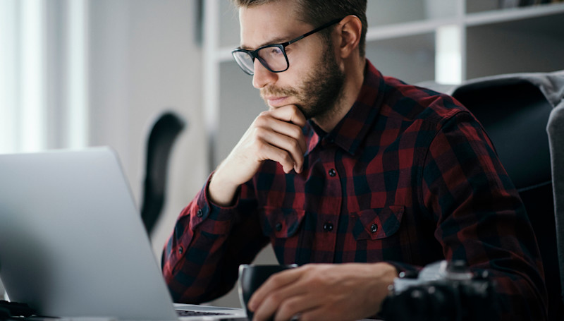 man looking at laptop