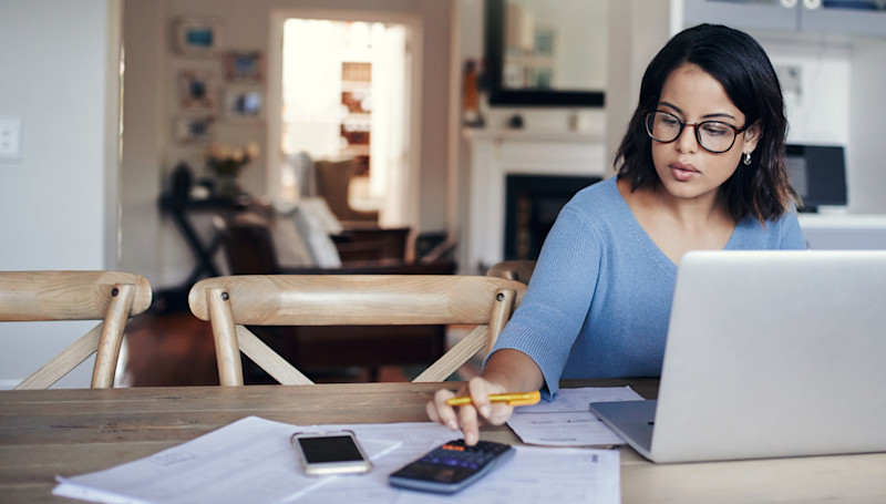 woman with laptop and calculator