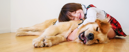 Girl laying on a dog