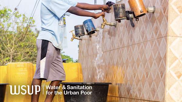 Ashanti Programme - A child fetching water at the standpipe