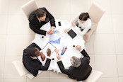 A business meeting at a round table.
