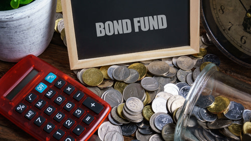 Bond funds, coins, red calculator.