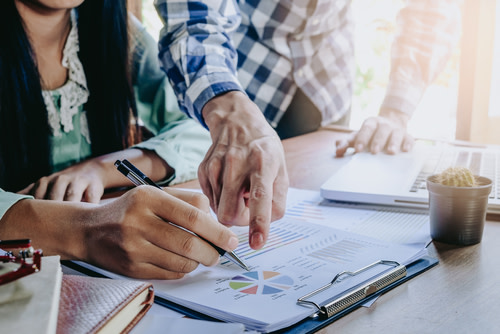 People reviewing Mutual Fund Prospectus
