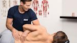 Physiotherapist treating lumbar spine