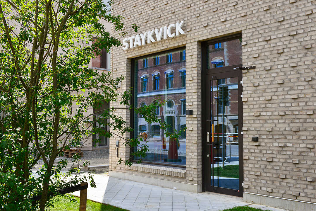 Staykvick Boutique Hostel in Helsingborg from outside. Green trees and windows from the kitchen.