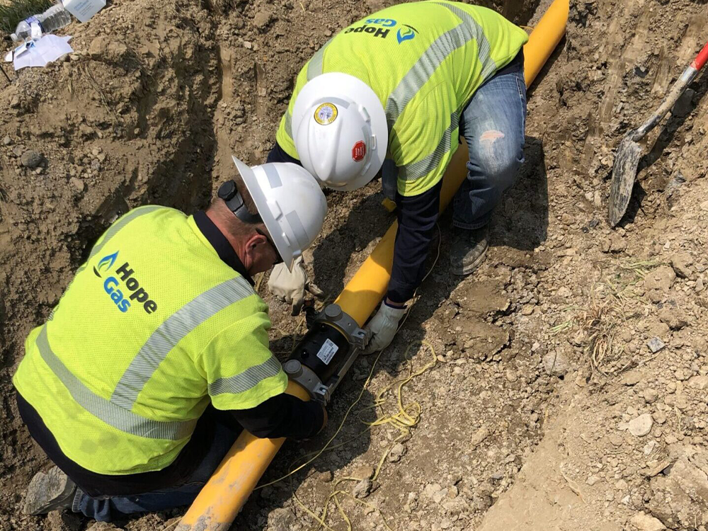 Hope Gas workers fixing pipeline