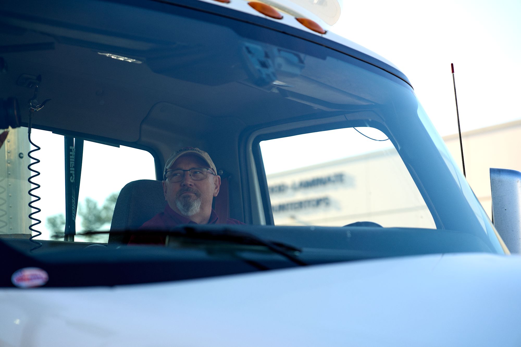 Man sitting in truck cab