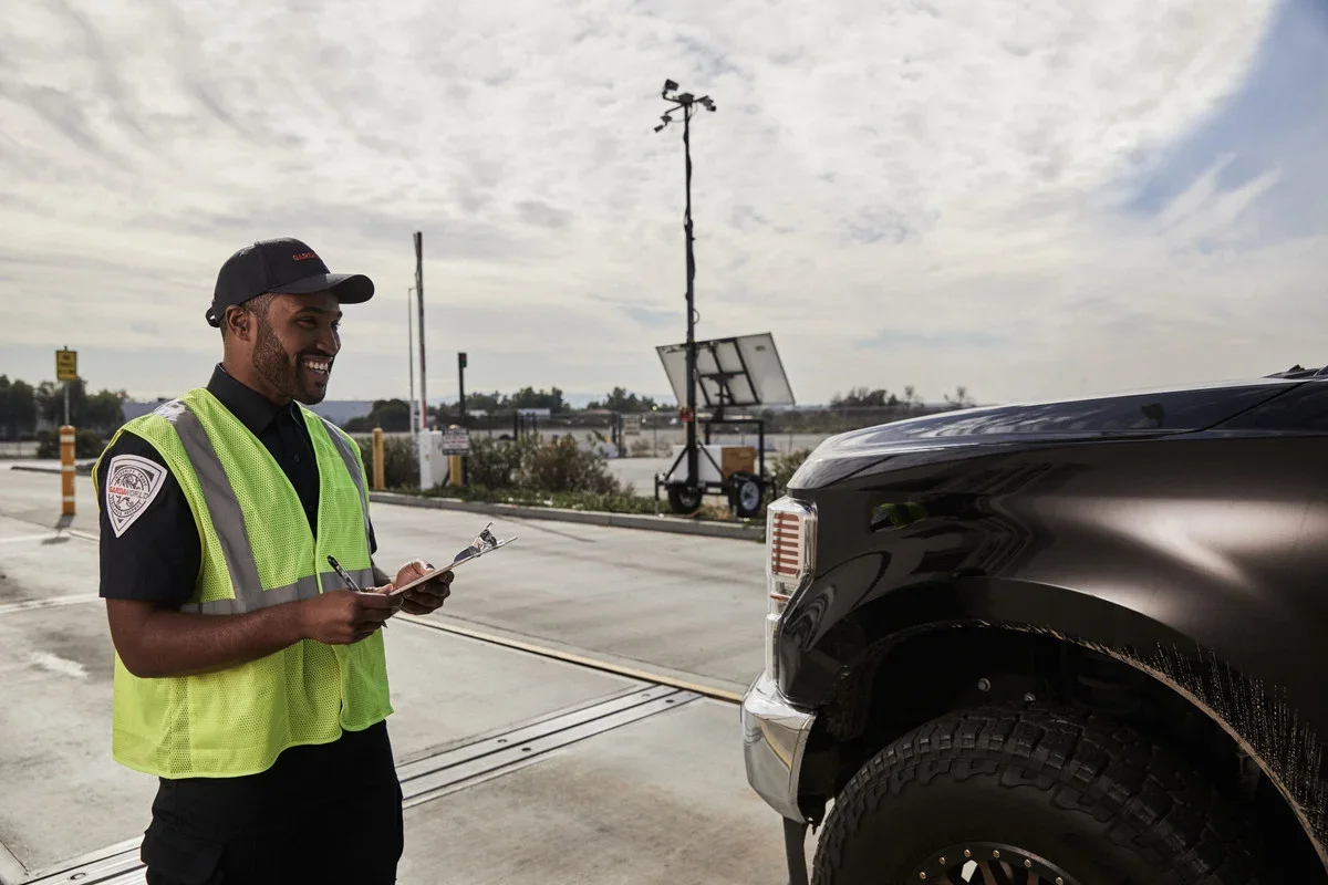 Driver inspecting vehicle