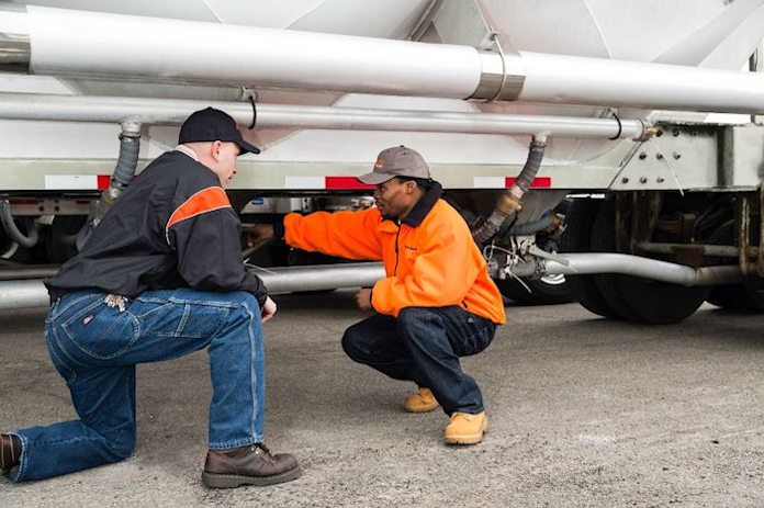 Bulkmatic drivers working on a truck