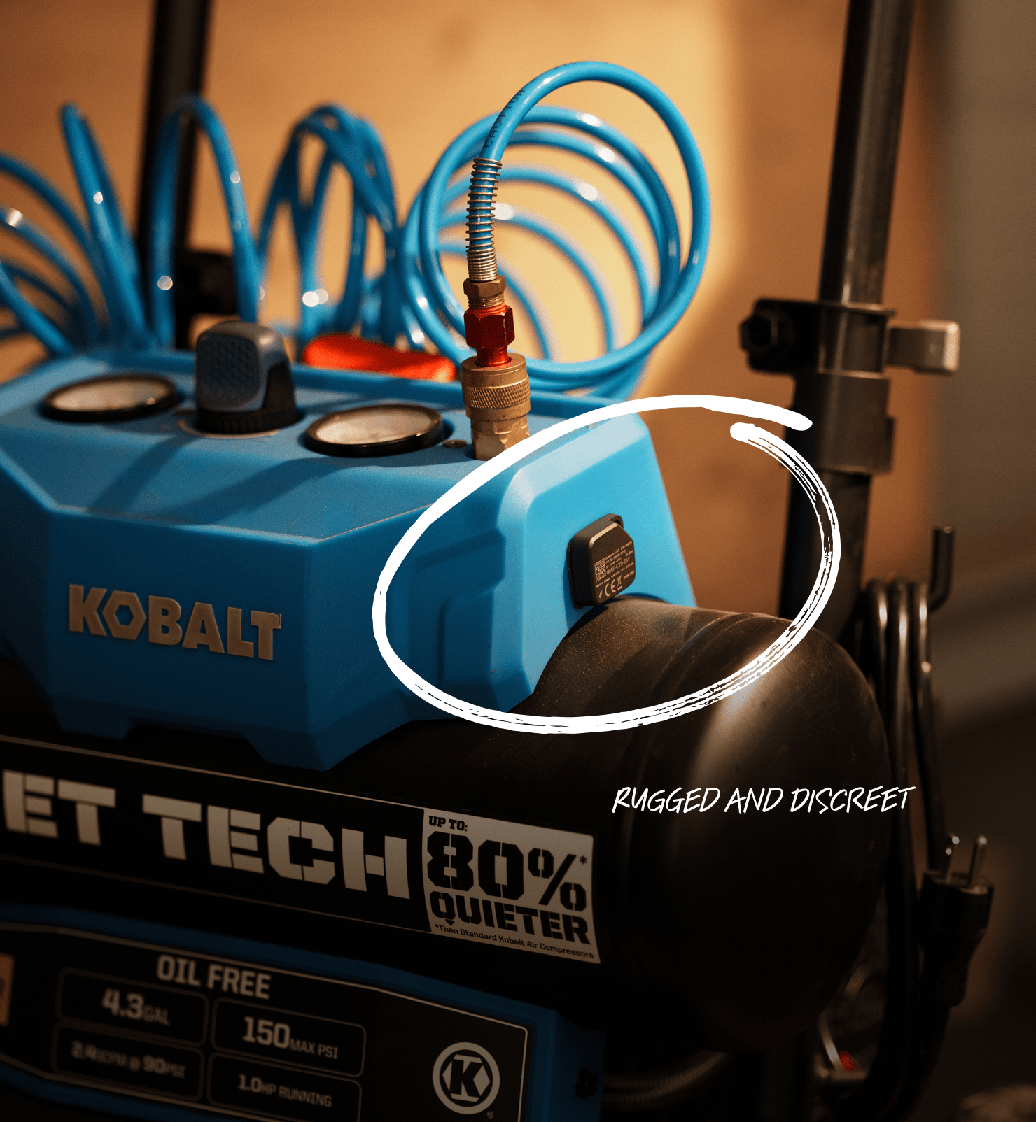 Kobalt Quiet Tech air compressor with a blue hose and the text 'Rugged and Discreet' circling an asset tag.