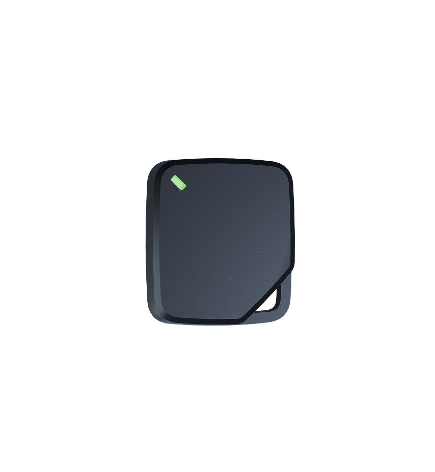 Dark gray square device with rounded corners, featuring a small green indicator light in the upper left corner.