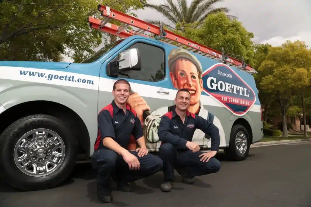 Men in front of van