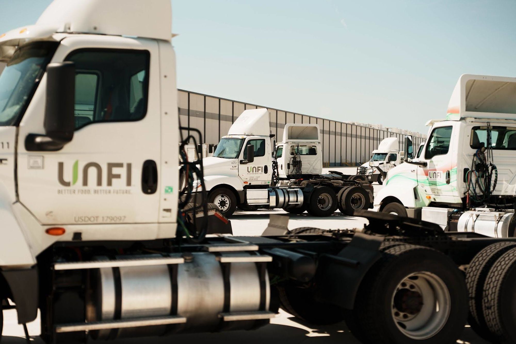 UNFI trucks in yard