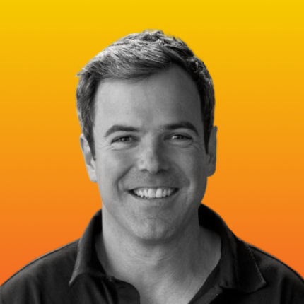 David Gal shown in black and white, against a vibrant orange-yellow gradient background.