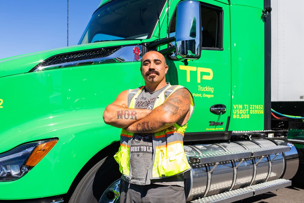Man standing in front of truck